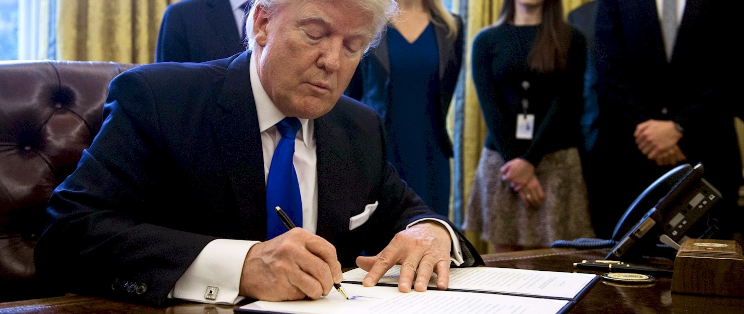 Picture: President Donald Trump signs the Muslim Ban executive order